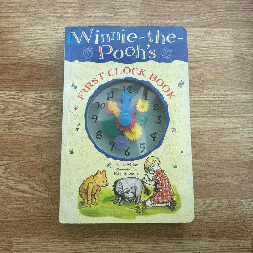 Hardcover The World of Winnie The Pooh's First Clock Book by A.A. Milne