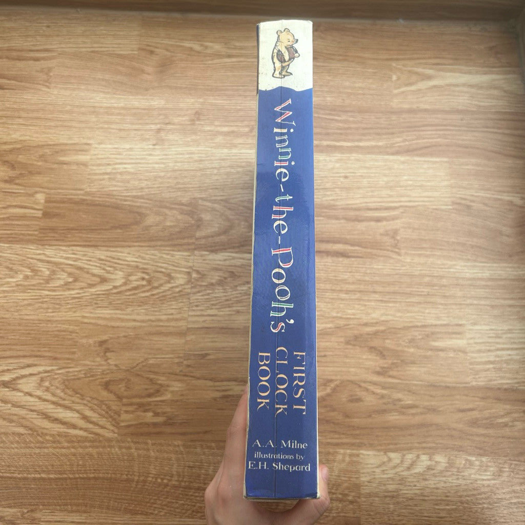Hardcover The World of Winnie The Pooh's First Clock Book by A.A. Milne